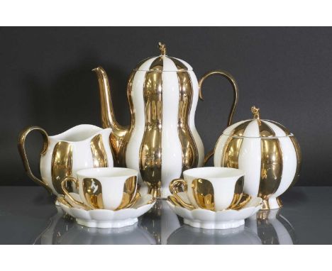 An Austrian Augarten 'Melon' mocha set, designed by Josef Hoffmann in 1929, comprising: a coffee pot and cover, a creamer, a 