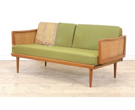 A Danish 'Model 453' teak daybed,designed by Peter Hvidt and Orla Mølgaard-Nielsen for France & Son, with cane sides which hi