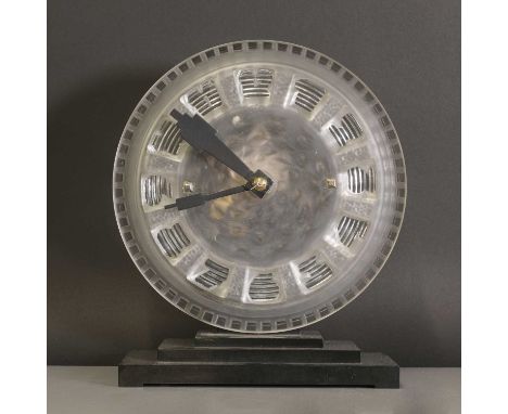 An Art Deco ATO Clock Company desk clock, with a moulded and frosted glass dial, moulded 'ATO', with a Léon Hatot electric mo