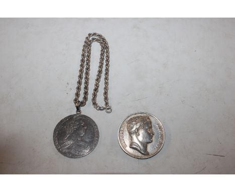 A silver M. Theresa coin converted to a pendant on silver chain and a coin of Napoleon Emperor and King in silver converted t