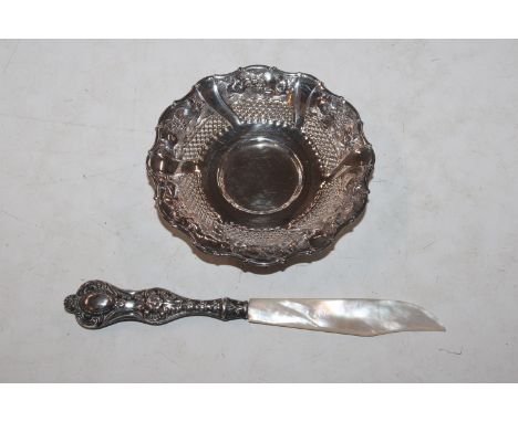 A pierced silver dish approx. 26gms and a silver handled and mother of pearl knife 