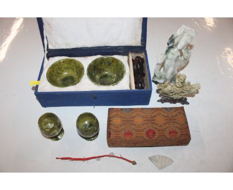 A carved soapstone ornament; another ornament AF; a boxed set of mother of pearl panels; a pair of jade coloured goblets and 