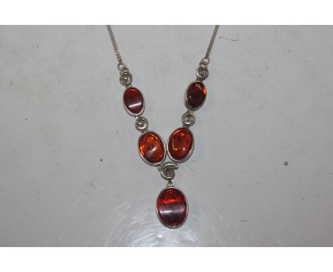 A Sterling silver and amber Y front necklace, approx. 12.5gms 