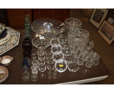 A quantity of various table glassware top include iridescent glass bowl, vintage glass bottles, preserve jar etc.
