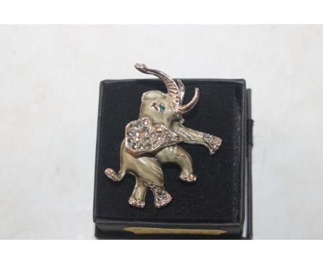 An antique enamelled and Sterling silver elephant brooch 