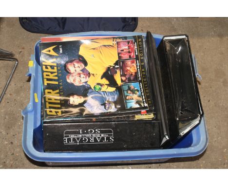 A box of Star Trek and Star Gate magazines 