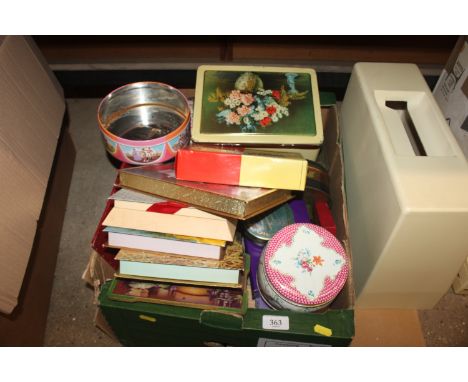 A box containing various vintage tins and boxes 