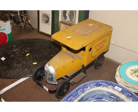 A vintage wooden and metal toy delivery van "Evening News"