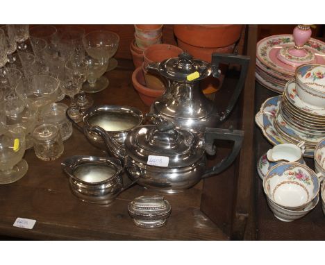 A silver plated tea and coffee pot and a table lighter 