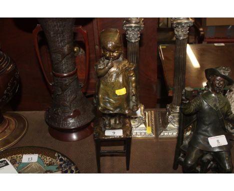Juan Clara Ayats 1875-1958, bronze sculpture of a young girl standing on a rush seated stool holding beads, stamps underneath
