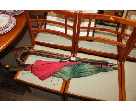 A quantity of silver capped walking sticks; a silver capped and collared parasol etc.