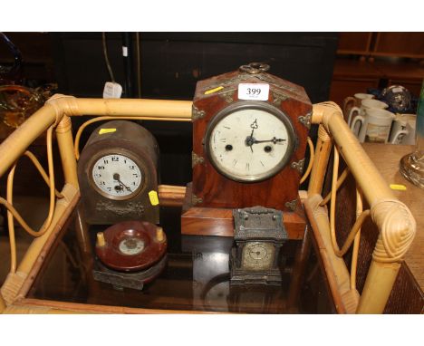 A walnut cased eight day mantel clock; two other clocks; a vintage fishing reel etc. 