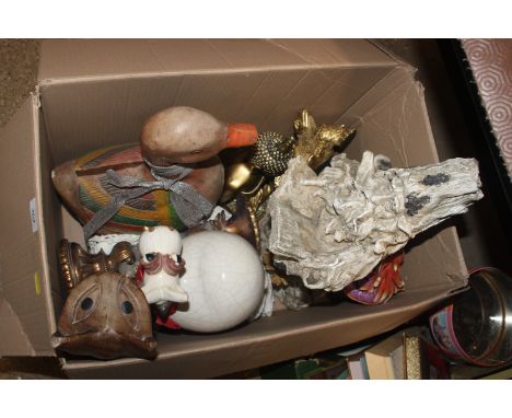 A box containing various ornaments, Buddhas, carved wooden duck, gilt candlestick etc.