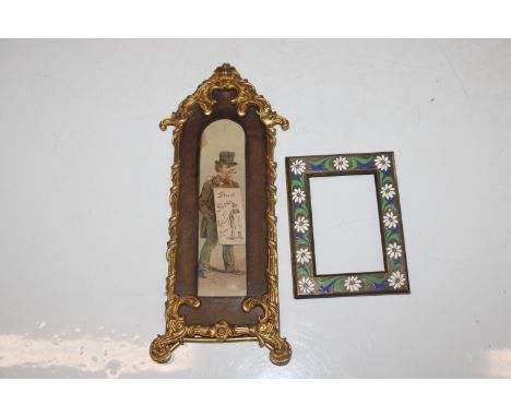 A small vintage brass frame decorated with inlaid enamelled flowers; and an Ormolu frame containing street sketches of London