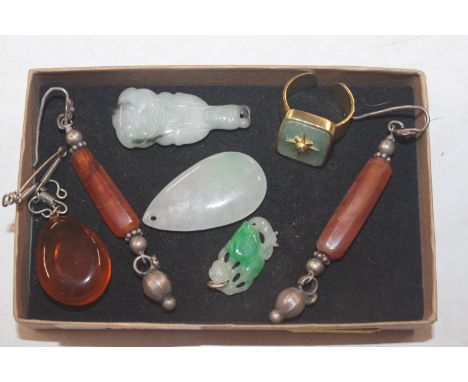A collection of amber coloured and jade coloured jewellery including ear-rings and dress ring