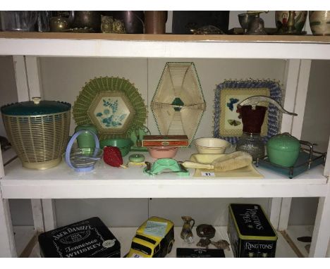 A shelf of 1950s retro table and kitchen ware