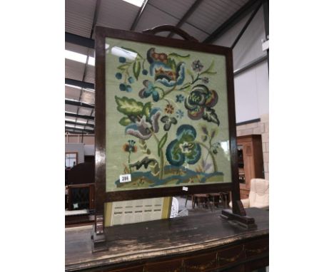 An oak framed tapestry firescreen