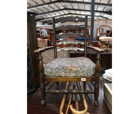 An oak ladder back carver chair