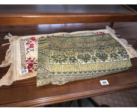 A tapestry throw and a prayer mat