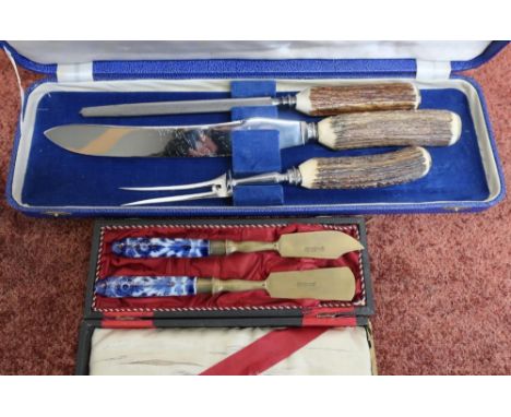 Cased 3 piece antler handled carving set and a stahlbronce copper and ceramic butter knife and spatula knife set 