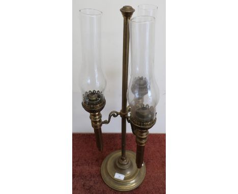 19th/20th C three branch brass oil lamp with turned circular base complete with chimneys (mounts converted for electric) (hei