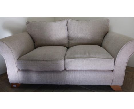 Modern two seat sofa in oatmeal type upholstery on light wood supports (width 160cm) 