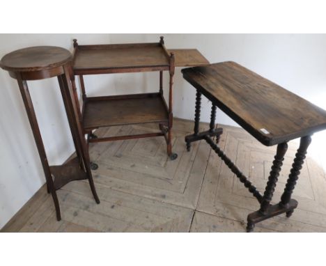 Victorian walnut table, turned bobbin supports and understretcher, early 20th C two tier oak tea trolley and an Edwardian oak