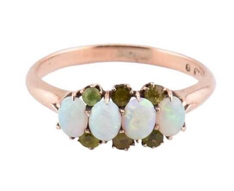 A 9ct rose gold, opal and garnet four stone cluster ring. The rose gold ring set with four oval opal cabochons flanked to the