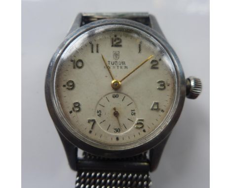A vintage Tudor Oyster stainless steel wristwatch, the dial with Arabic numerals, subsidiary seconds dial at six, with associ