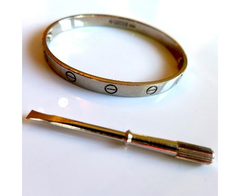 A Cartier 18ct white gold 'Love' bangle, the polished bracelet with screw detail, signed Cartier, stamped 750 with Swiss cont