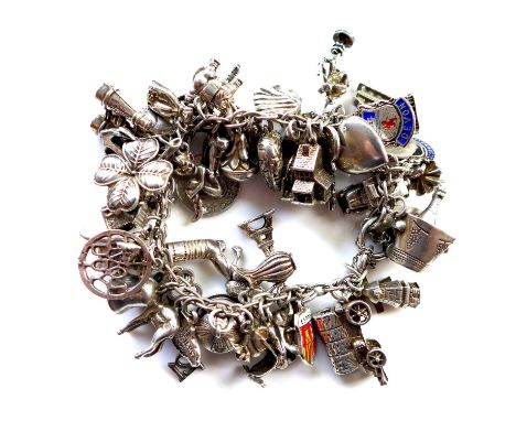A vintage silver charm bracelet with 50 charms attached, approx. 90g 
