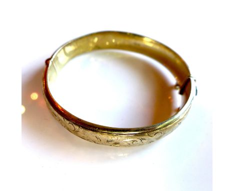 A silver gilt bangle, with floral engraving, by S P S & Co., hallmarked Birmingham 