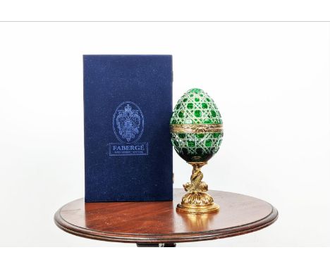 FABERGE EGG, green cut crystal number nine, hinged top opening to reveal green enamel foliate display on silver gilt with dol