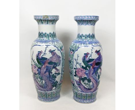 CHINESE FLOOR VASES, a pair, in a light blue green and pink palette with cartouches framing resting peacocks and crysanthemum