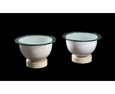 A matched pair of French glass-maker's pots, 1920s and later, glazed ceramic, remnants of glass, now converted to tables with