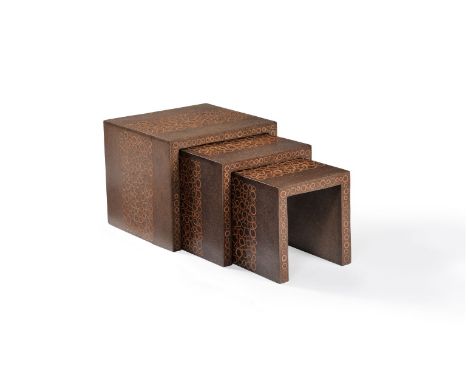 A nest of three tables, 1980s, laminated wood, inlaid with bamboo sections, 45cm high, 52.5cm wide, 50cm deep      Provenance