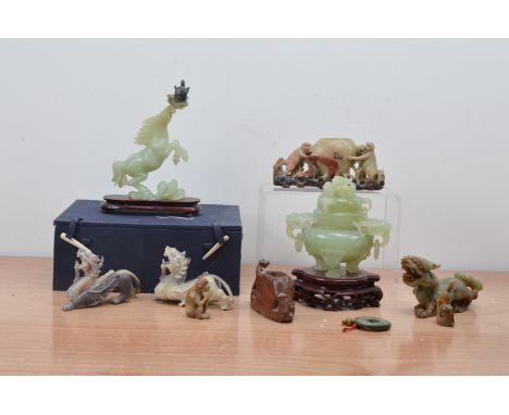 A collection of 20th century Chinese jade and hardstone sculptures, comprising a jade horse in a box, a twin handled jar and 