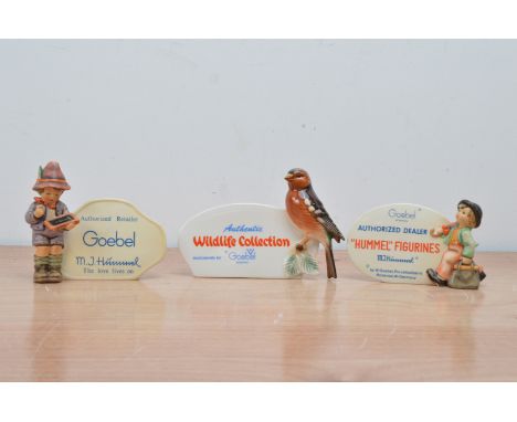 Three Goebel ceramic advertising plaques, two with children the other with a bird (3) 