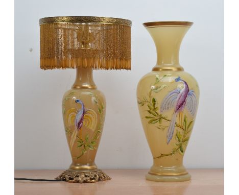 Two modern opaque glass vases, both with gilt rims and a hand painted bird design, signed indistinctly towards the base, the 