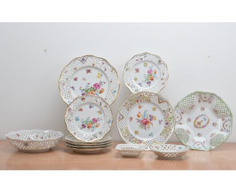 A collection of 20th century German ceramic items, all with reticulated pierced borders and floral painted designs, of differ