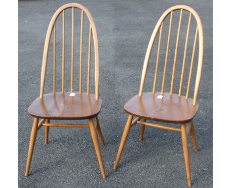 Ercol - a pair of 1960s blonde elm and beech 'Quaker' chairs, with turned spindle backs and on tapered legs, each approx. 95.