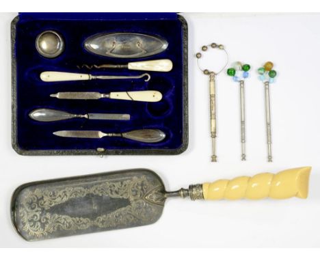 AN ELIZABETH II SILVER LACE BOBBIN, 10CM L, LONDON 1979, TWO OTHER LACE BOBBINS, AN EPNS SERVER AND A SILVER MANICURE SET