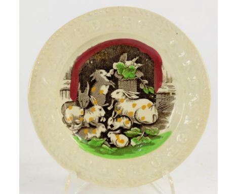 A BRITISH EARTHENWARE ALPHABET MOULDED CHILDS PLATE PRINTED IN SEPIA, PICKED OUT IN ENAMEL WITH A FAMILY OF RABBITS, 15CM D, 