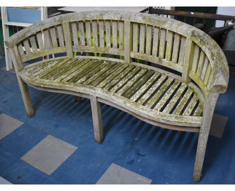 A Wooden Garden Bench of Crescent Form, 156cm wide