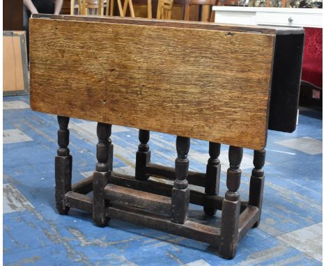A 19th Century Oak Gate Leg Drop Leaf Rectangular Table, 82cms Long