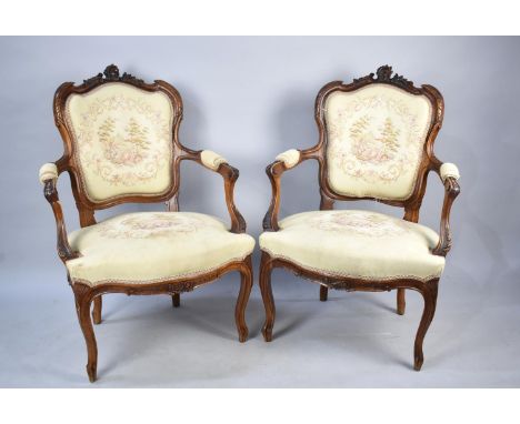A Pair of Walnut Framed French Style Salon Ladies Armchairs with Tapestry Fabric Upholstery and Requiring Renewal