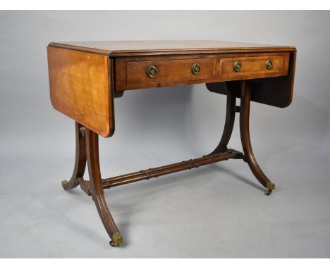 A Reproduction Drop Leaf Sofa Table with Two Drawers and Brass Casters, 96cms Wide When Closed