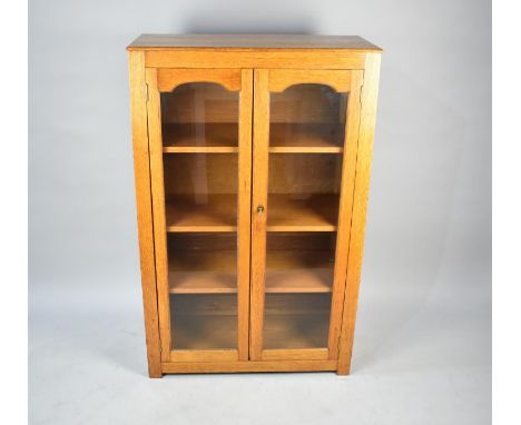 An Edwardian Oak Glazed Three Shelf Bookcase, 77cms Wide