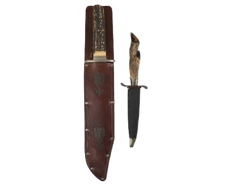 A large I.XL. bowie knife by George Wostenholm &amp; Son, heavy clip-point blade 10 in., oval cross piece in German silver, t