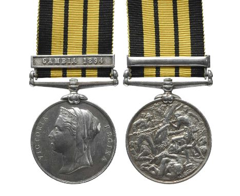 An East and West Africa Medal to Gunner T. Berridge, Royal Navy, clasp: Gambia 1894 (T. BERRIDGE, GUNNER R.N.. H.M.S. RALEIGH